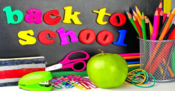 Back to School Sign with Apple, Scissors, and Colored Pencils in the Foreground